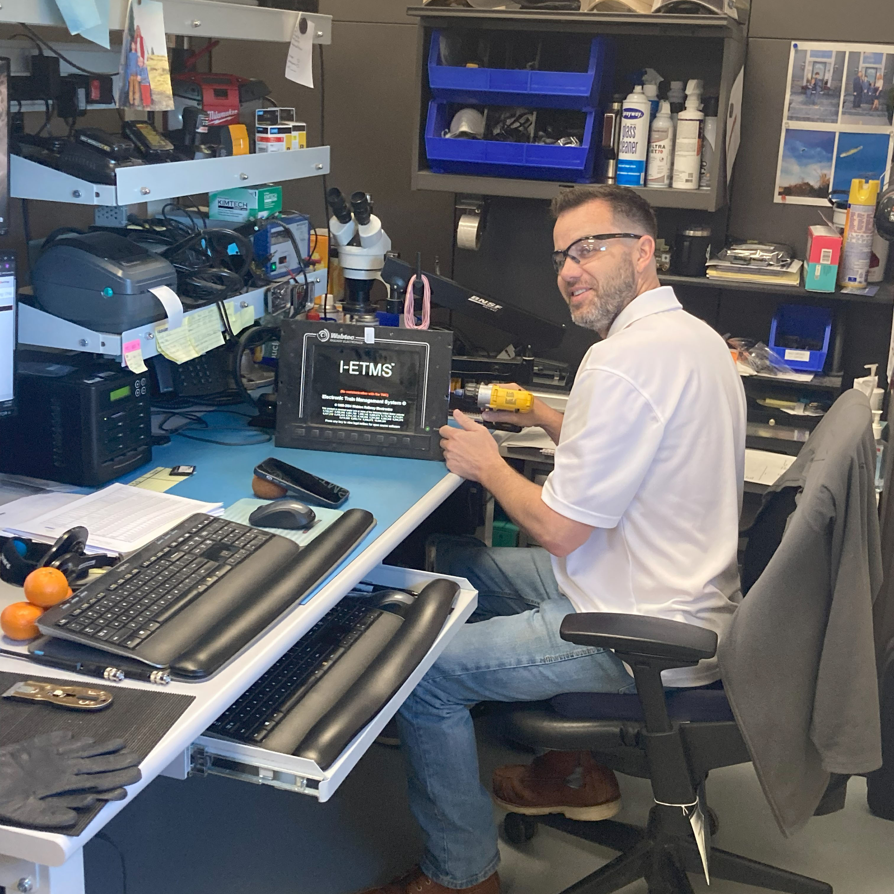 Curtis Faulconer, electronic technician II, repairs an I-ETMS console. 